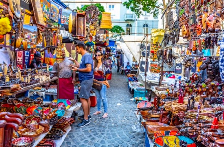 A close view of the bustling street market in Cape Town, South Africa, renowned for its vibrant atmosphere and diverse artisan goods.