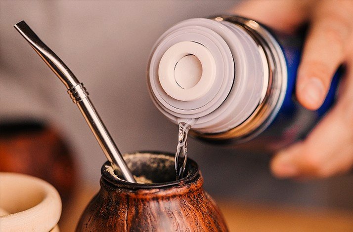 Yerba mate being poured into a cup  