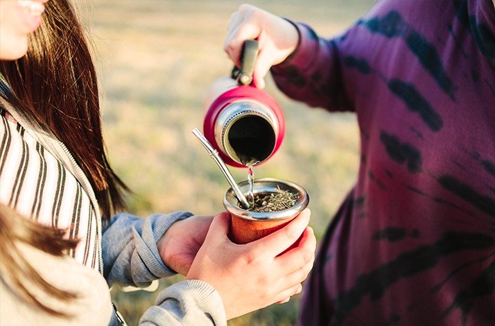 Yerba mate being poured into a cup  