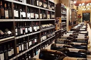 Shelves full of Argentine wines at Tierra Mendocina Wine Bar
