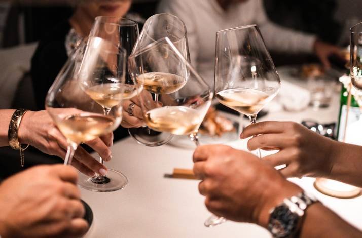 A group toasting with their glasses of wine at Konoba Kala