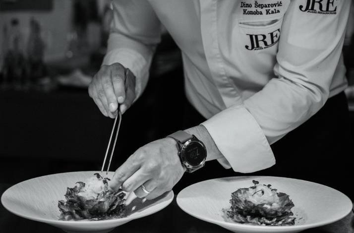 Chef Dino Šeparović garnishing dishes at Konoba Kala
