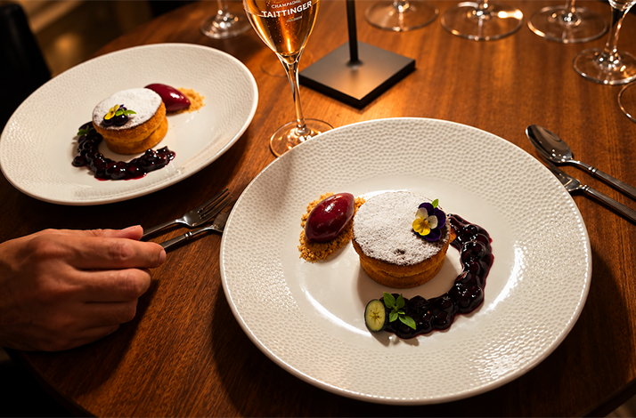 Dessert plates with berry compote and powdered cake, served with champagne at Atlantik Fisch.