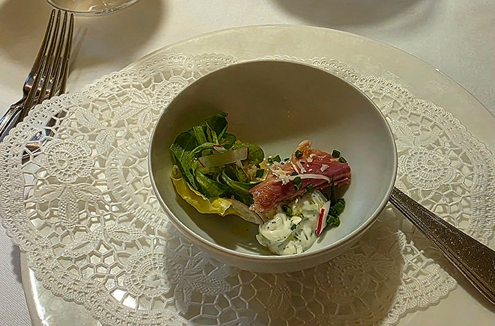 A bowl displaying sea products at the Restaurant Nymphenburger Hof.