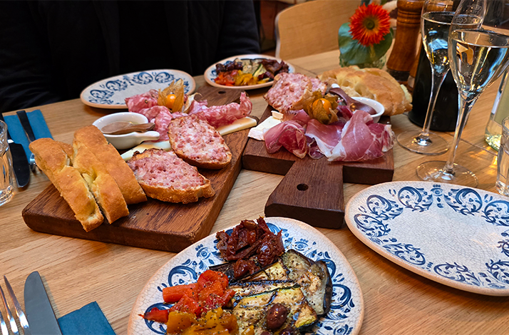 A table with a variety of Italian antipasti served at restaurant Rustikeria.