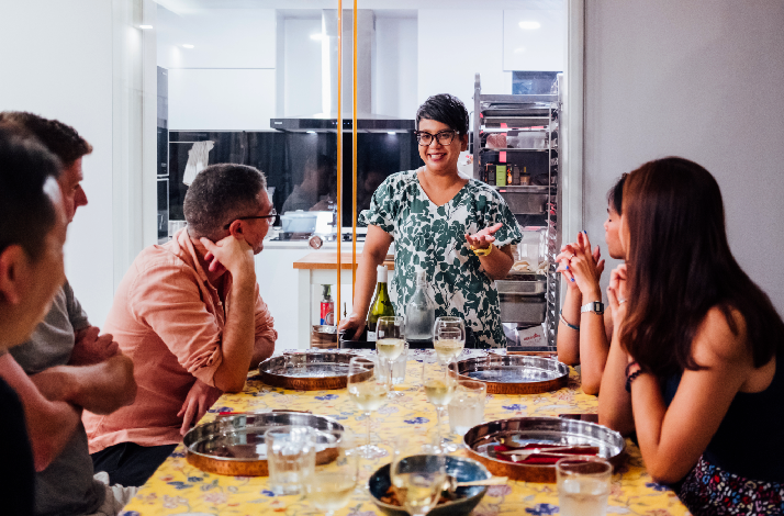 Guests hosted by South Indian chef Vasunthara Ramasamy for home dining experience.