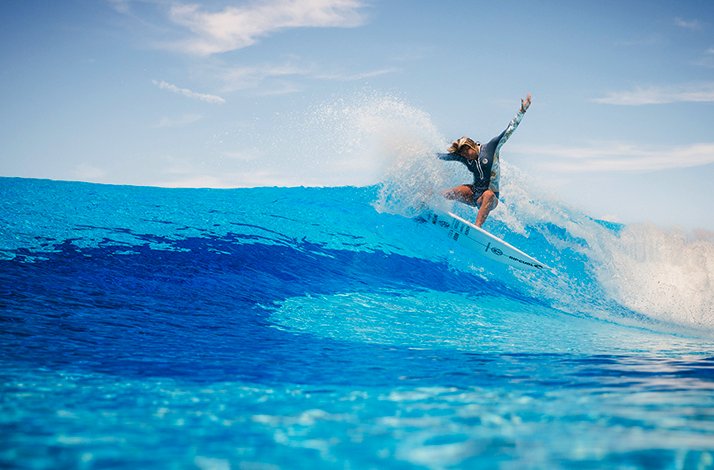 Person riding a wave during surf session at O2 Surftown in Munich, Germany.