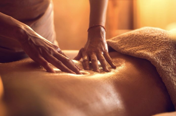 Closeup of a person getting a body massage at hotel cala joncols at Girona