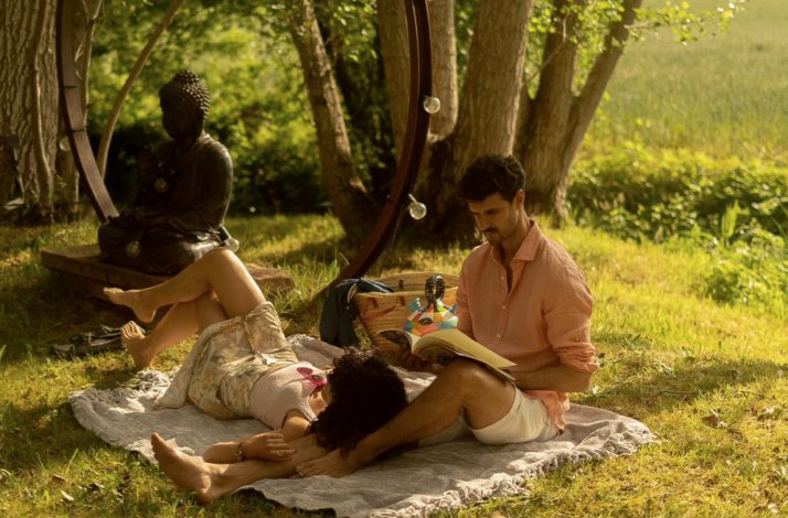 The couple are relaxing at the outdoor area of the hotel.