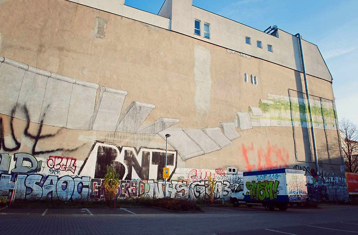 A wall covered in street art in the Kreuzberg neighborhood of Berlin.