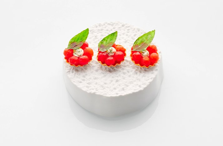 Baby tomato tart served at 2 michellin star restaurant Jaan in Singapore