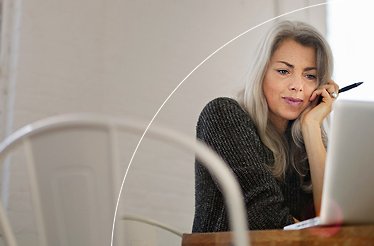 Woman looking at laptop screen.