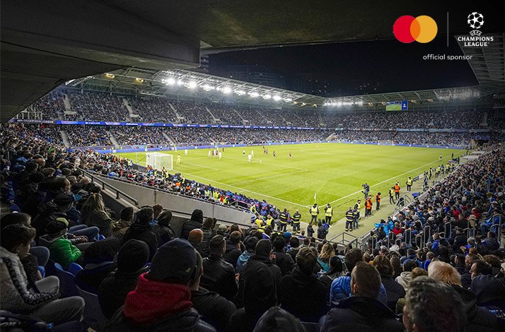 A view of the football pitch from the stands. Mastercard and UEFA logos at the top right corner.