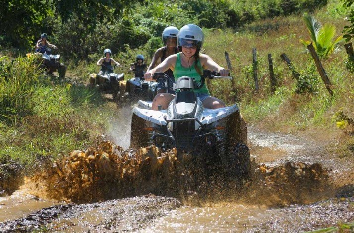 Group of people sitting on a ATVs during Tour through Jamaica's Landscapes
