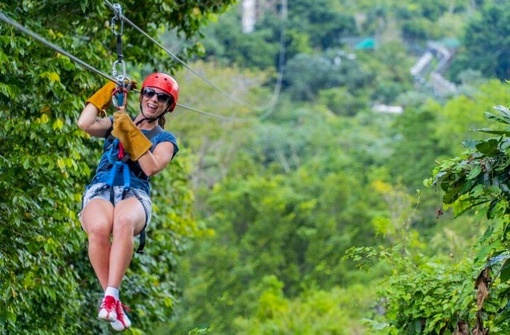 The lady is smiling and enjoying an adrenaline-pumping adventure in Punta Cana.