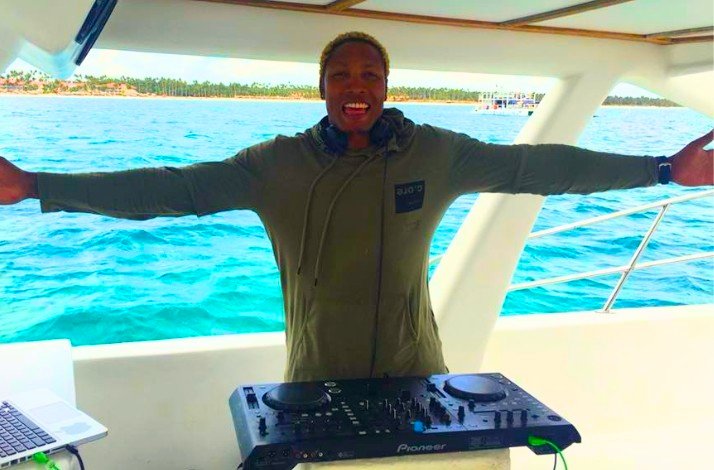 DJ plays music on a luxury party boat.