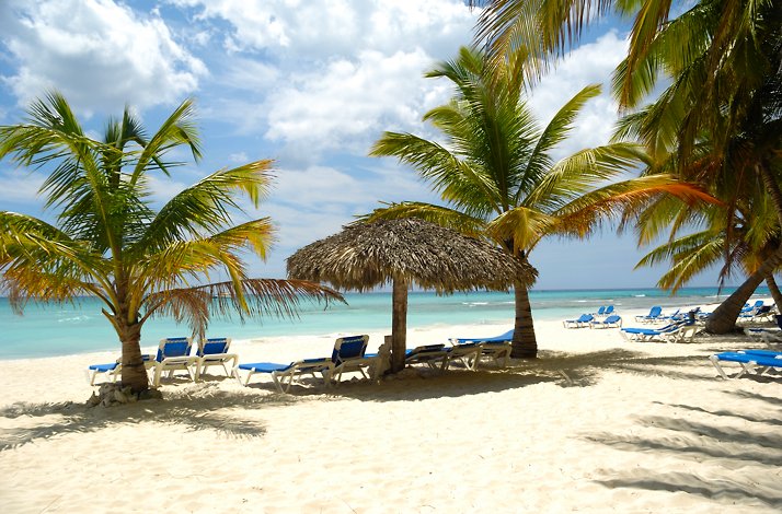 Sunbeds on the beach overlooking Caribbean Sea, Saona Island.