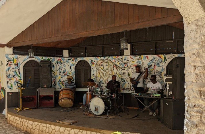 Reggae musicians performing on stage.