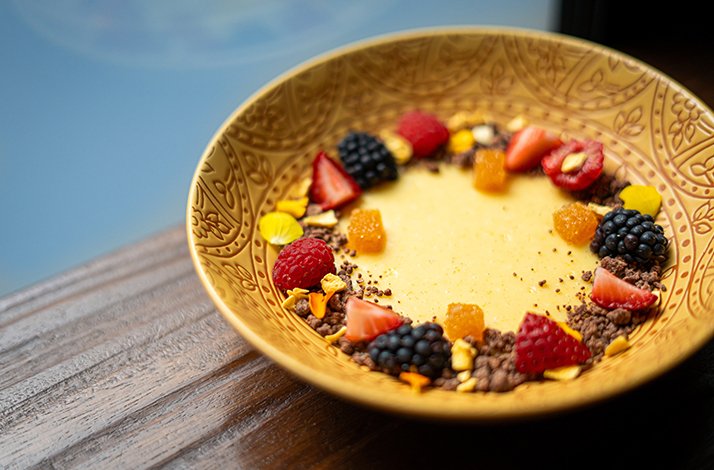 Relish a locally sourced tasting menu that includes an exclusive extra dish: In Dubai, United Arab Emirates A dessert decorated with strawberry, blueberry and other fruits, served at Michelin star restaurant BOCA