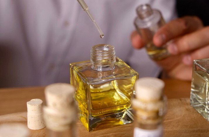 A male model making eco-friendly perfume by Crispy