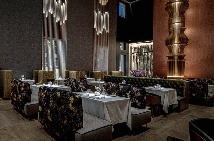 A view of the cozy interior featuring dining tables and lightnings at the DaNico.