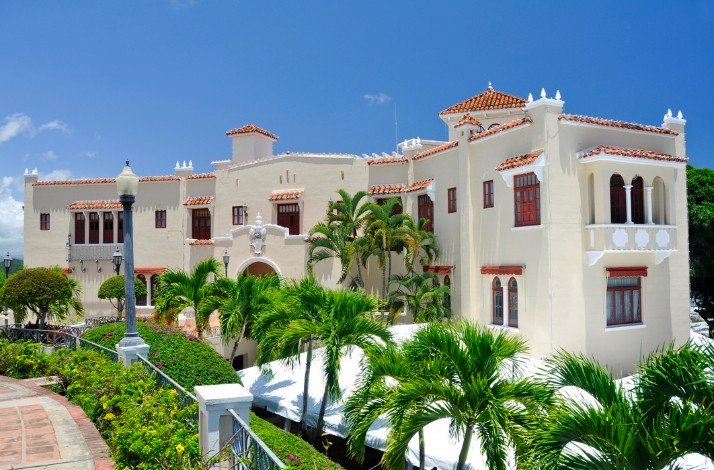 The front view of the Castillo Serrallés surrounded by greenery in Ponce, Puerto Rico.
