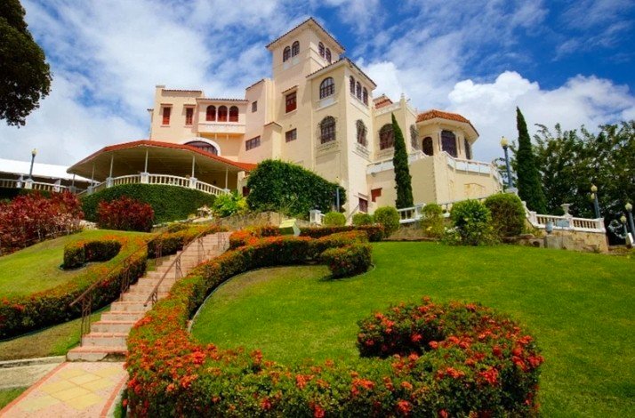 The shot from below of the Castillo Serrallés showcasing vibrant garden and greenery in Ponce, Puerto Rico.