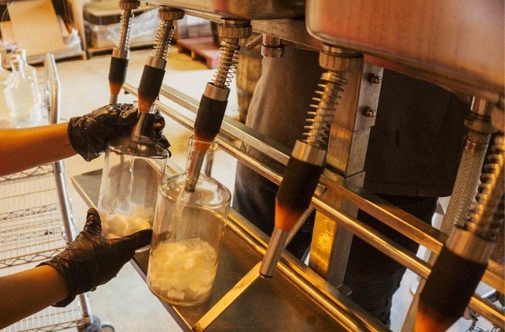 The process of pouring the award-winning Tres Clavos rum at San Juan Artisan Distillers