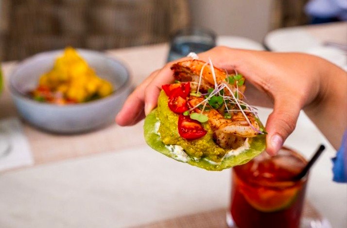 A dish being held by a visitor at the Sand Street Bistro.