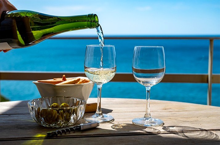 The champagne is pouring into the glasses by the panoramic sea views at the Sand Street Bistro.