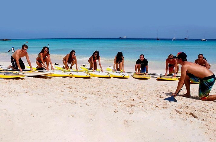 The instructor showing the participants the initial steps for surfing