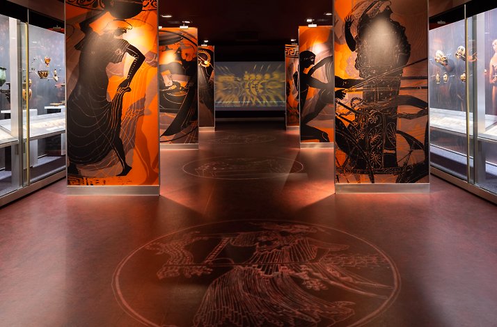 One of the halls at Museum of Cycladic Art in Athens with panels decorated with Greek historical paintings.