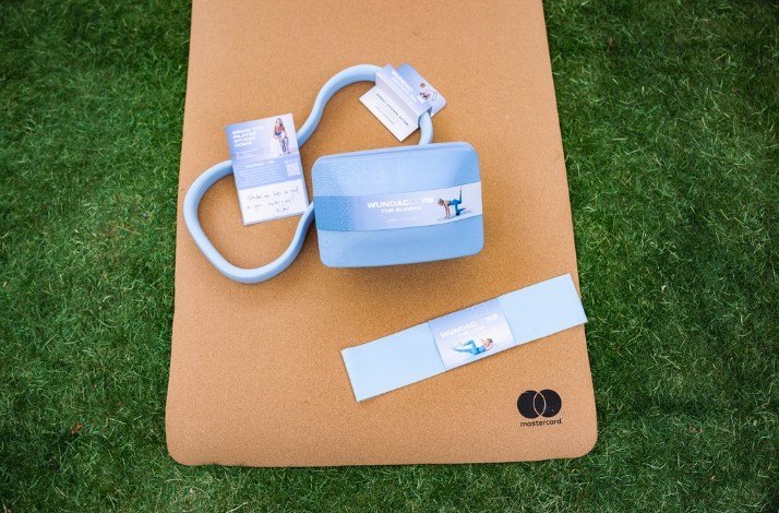 A WundaCore Pilates Loop on a mat with a Mastercard logo on it