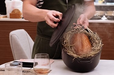 Chef Ethan Khoo preparing a dish at Kanves Singapore