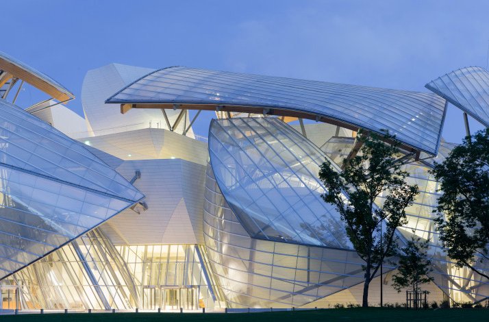 Outside view of a Fondation Louis Vuitton modern building at evening.