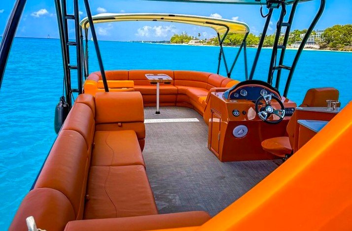 Inside of the luxury double-decker catamaran with orange seats
