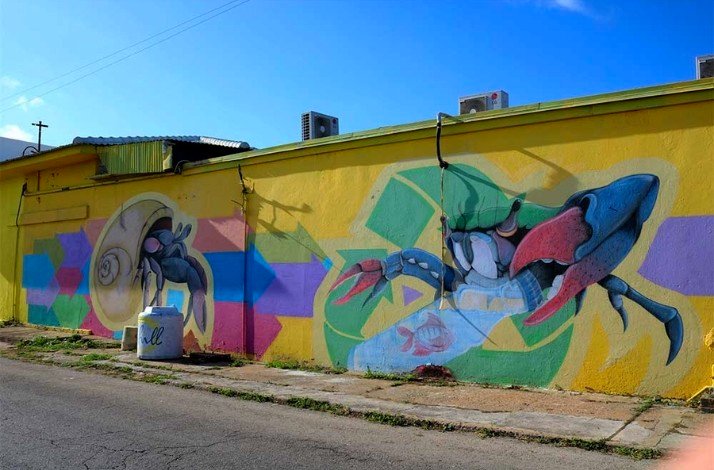 The vibrant street art showcasing an artistic representation of fictional characters in San Nicolas, the heart of Aruba's art scene.