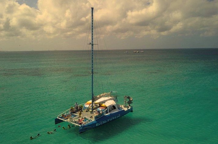 A catamaran sailing in the ocean at Palm Beach, Aruba. 