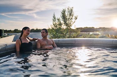 A couple inside of an exterior pool in Fingal, Australia