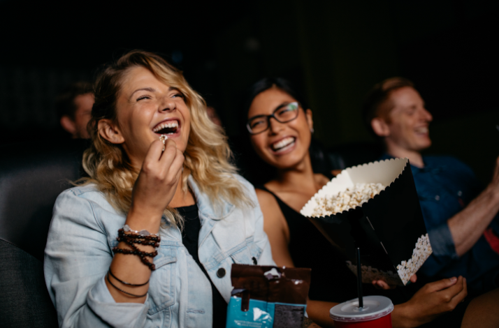People eating pop-corn while watching a movie at ODEON Cinema