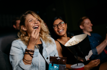 People eating pop-corn while watching a movie at ODEON Cinema