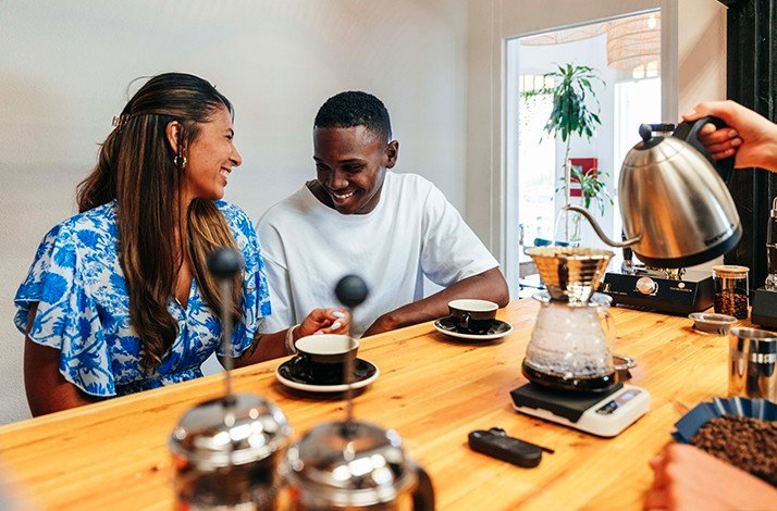 Two people enjoying coffee at the Van Gogh Specialty Coffee & City Roastery