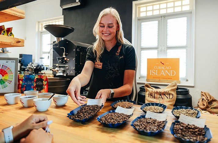 Barista showing different coffee beans used at the Van Gogh Specialty Coffee & City Roastery