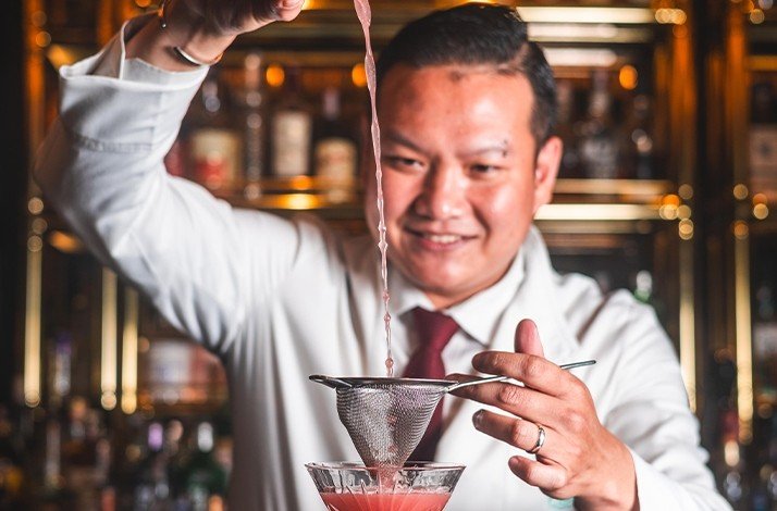 Bartender making a cocktail at the Firefly bar