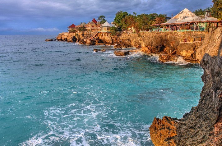 Hotel huts on the coast of the Caribbean Sea, view from the sea.