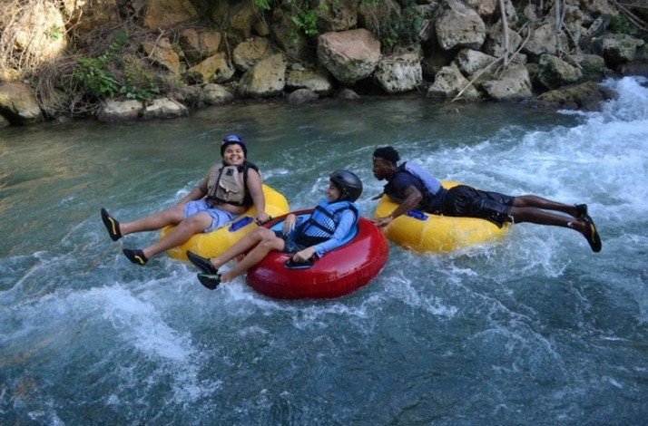 Kids river-tubing with a guide in Jamaica