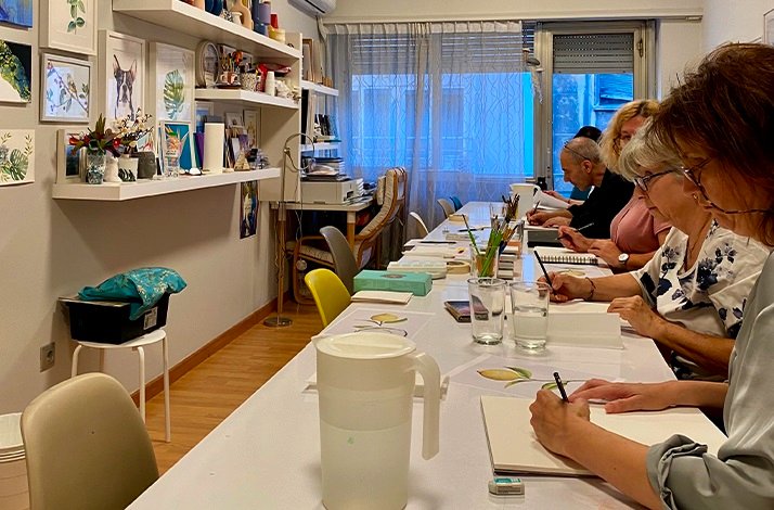 A group of persons on a workshop for knitting