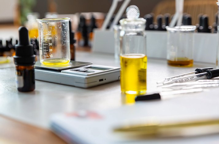 A close up at the bottles and test tubes for fragrance making workshop.