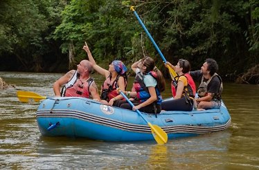 A group of people enjoying a thrilling guided river safari.