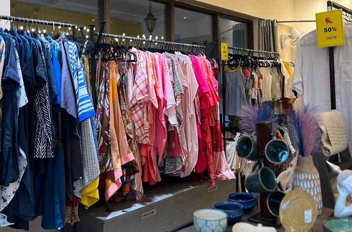 Racks and shelves with clothes and accessories in one of the clothing stores in Panjim, India.